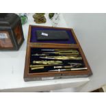 A Victorian set of drawing instruments in rosewood fitted box and one later smaller set