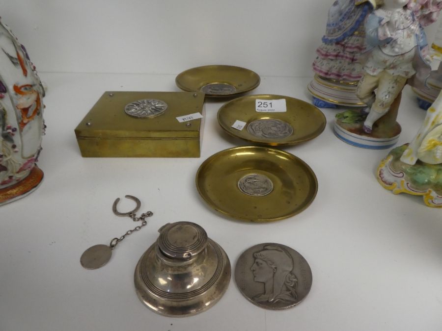 A small silver inkwell, 3 brass dishes having silver inset plaques, stamped 900 and sundry