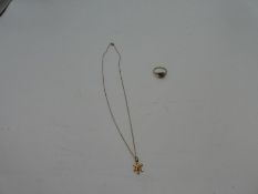 9ct yellow gold dress ring, 9ct yellow gold neckchain hung with a snowflake pendant and diamond chip