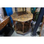 An old carved oak octagonal two tier occasional table and a small carved oak stool