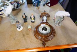 A carved wooden barometer and a selection of ceramic figures incl. Doulton and Lladro
