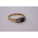 18ct and platinum sapphire and diamond dress ring, central square cut sapphire with illusion set dia