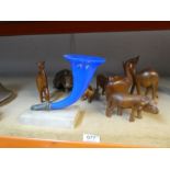 An old blue glass cornucopia on alabaster base and a selection of vintage teak animals