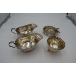 A pair of silver sauce boats having beaded border hallmarked Birmingham 1923 Adie Brothers Ltd. Also