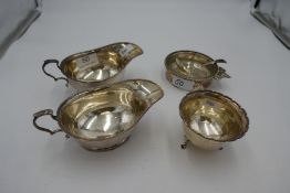 A pair of silver sauce boats having beaded border hallmarked Birmingham 1923 Adie Brothers Ltd. Also