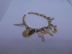 18ct yellow gold bracelet by Indaerre 750, four 9ct charms, 1 14K turtle charm, one 18ct charm and 2