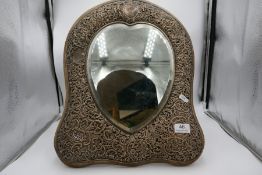 A very large silver mirror having pierced floral decoration. Hallmarked Birmingham 1897 Henry Matthe