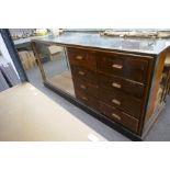 An old Haberdashery shop counter, having 8 drawers beside open shelf with brass decoration, 180cm, a