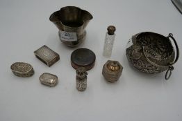A mixed lot comprising a silver Chester matchbox cover, silver bottle and topped cut glass bottle, a