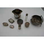 A mixed lot comprising a silver Chester matchbox cover, silver bottle and topped cut glass bottle, a