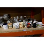 A selection of mostly souvenir miniature ceramics, tankards, etc