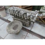 Two old garden troughs decorated figures and an urn