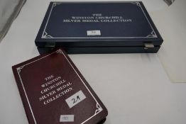 The Winston Churchill silver medal collection with the booklet with guarantees. A large blue case co