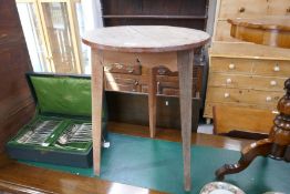 An antique pine circular table on 3 chamfered legs, 50cm