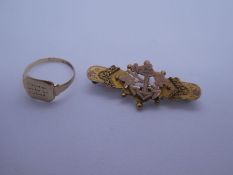 9ct yellow gold brooch of decorative design, marked 9ct, and 9ct yellow gold signet ring, marked 375