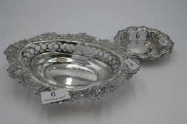 A silver William Comyns and Sons decorative Victorian fruit bowl with ornate design and pierced deco