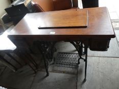 An old treddle sewing table, minus machine
