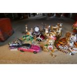 A selection of enamelled pill boxes, mostly in the form of animals, tigers, birds, etc