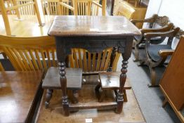 An antique joint stool having carved frieze and two other smaller stools