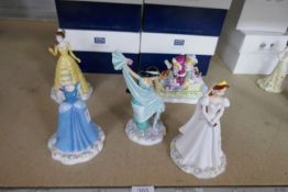 Four Doulton Disney figures, boxed and one other figure group (Winter Fun), boxed
