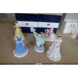 Four Doulton Disney figures, boxed and one other figure group (Winter Fun), boxed