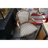 A pair of French Beech open armchairs having striped upholstery