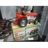 Vintage Ford 500 Battery operated tractor in good box and T M Toys (Japan) Battery R/C cat in box wi