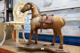 An antique probably Victorian ride along horse having straw filling