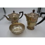 A silver tea and coffee pot of half reeded design, having reeded lid and border, on a raised pedesta