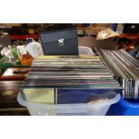 A quantity of vinyl LP records, mainly 80s and 7" singles