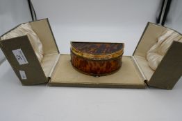 An exceptional silver gilt and tortoise shell box in a half circle shape. Standing on three ball fee