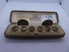 Cased set of 6 clover decorated gilt buttons 'Treble Orange' and 2 Lasserre buttons depicting a clas
