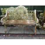 An old cast iron garden bench, early 20th Century, having pierced decoration with sabre legs, 118cm