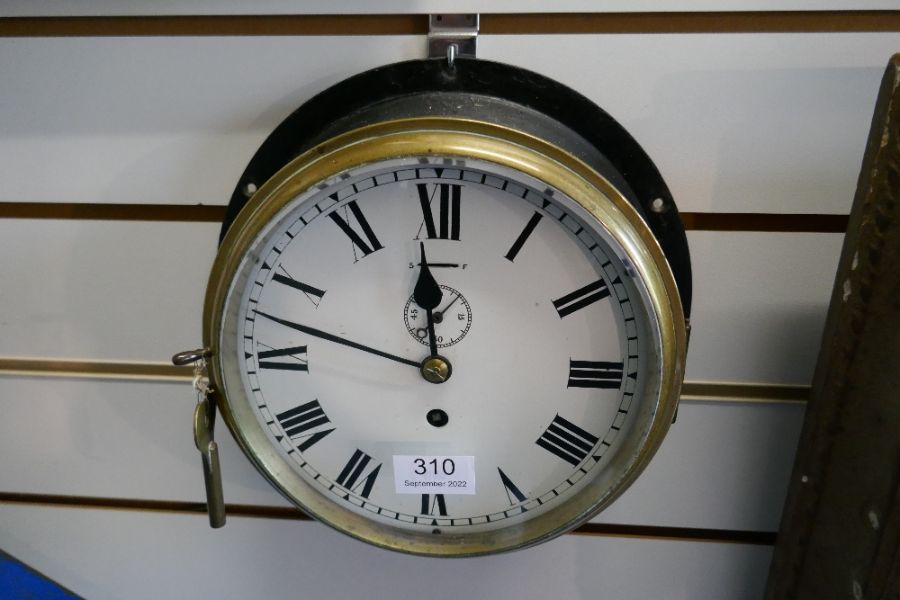 An old ships bulkhead clock having brass bezzle with black painted surround - Image 3 of 3