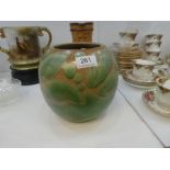 Vera Huggins, a Royal Doulton stoneware vase having green glaze and a Doulton Lambeth jug with motto