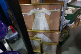 Four framed displays of vintage textiles