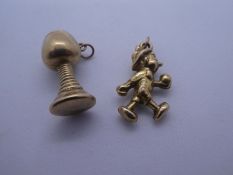 Georg Jensen, two 9ct yellow gold charms to include 'Pinnochio' and a Wine glass, both marked GJ Ltd