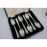 A set of silver handled Walker and Hall knives and forks Sheffield 1920s. Also with two cased sets o