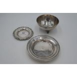 A silver trinket dish of circular form having decorative rim. Another smaller. Also with a silver tr