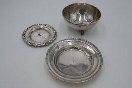 A silver trinket dish of circular form having decorative rim. Another smaller. Also with a silver tr