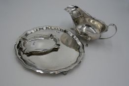 A silver Viners Ltd salver having scalloped edge design. Also with a silver Birmingham ash tray and