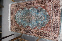 A modern part silk rug having central motifs, 188, 122cm