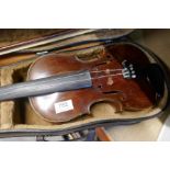 An old violin and bow in fitted case