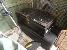 Two old black painted tin trunks