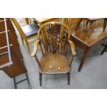 An antique oak Windsor Wheelback chair and one other smaller stickback chair