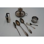 A quantity of silver including, silver candlestick holder, matchbox cover, and silver spoons. Variou