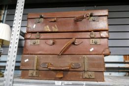 An old Leather suitcase and two others