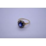 Antique sapphire and diamond cluster ring on plain polished shank, central oval faceted sapphire, ap