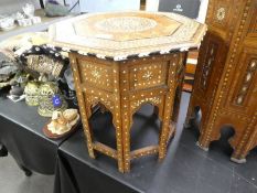 A Moorish octagonal bone inlaid side table with folding base, 41.5cm diameter