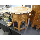 A Moorish octagonal bone inlaid side table with folding base, 41.5cm diameter